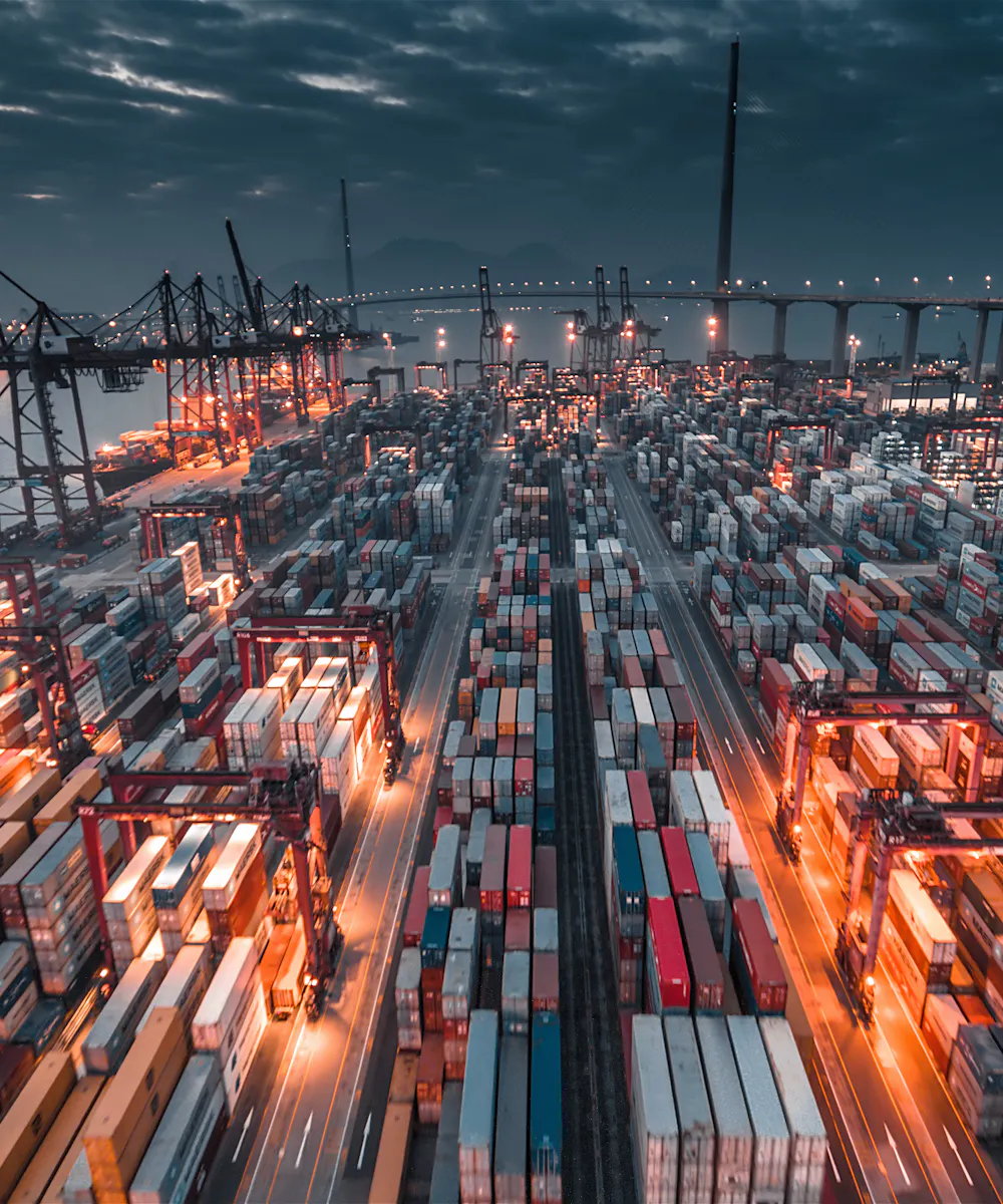 Container terminal with cranes at dusk